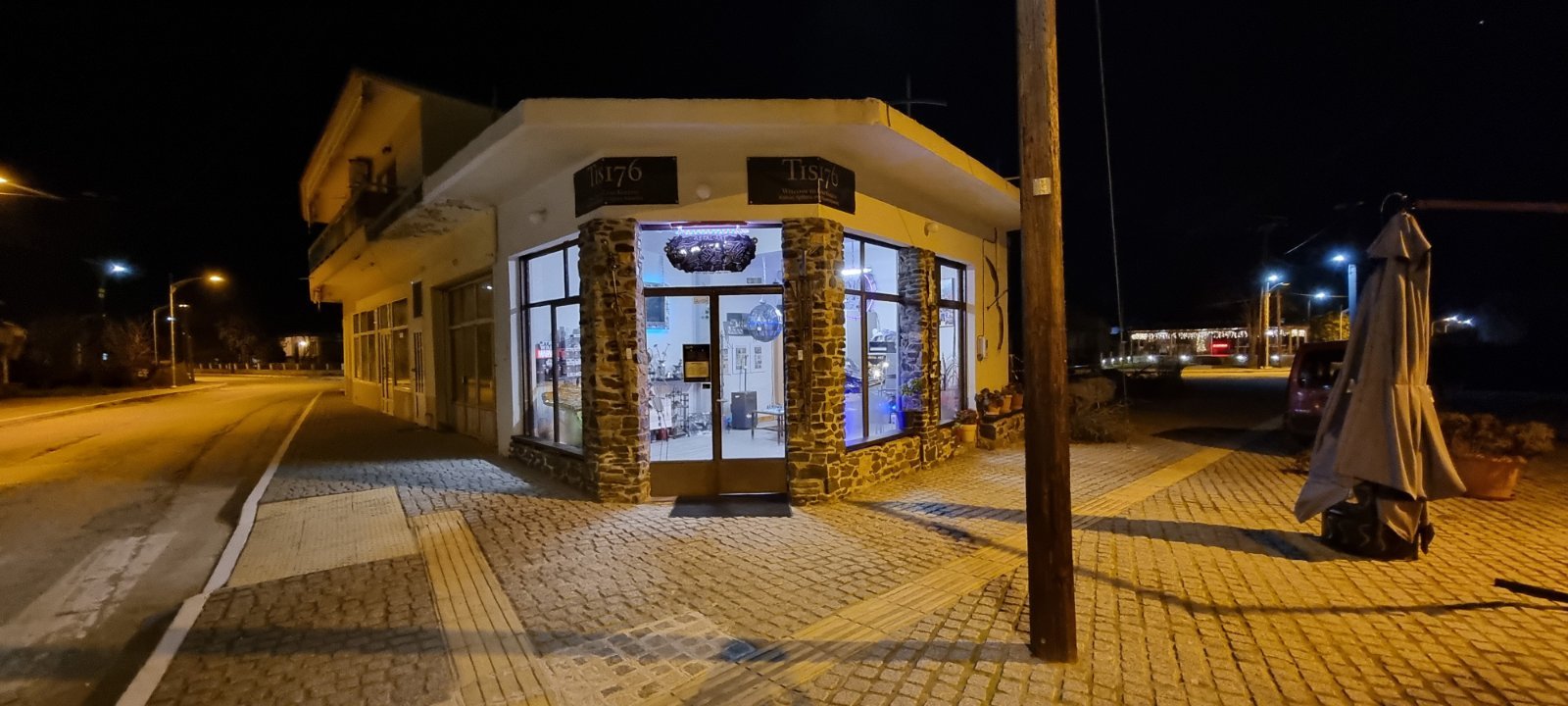 Historic stone monastery with arched colonnade and Byzantine tower near Lake Kerkini